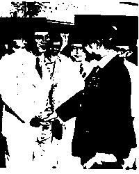 Sukarno (left) greets a Japanese official